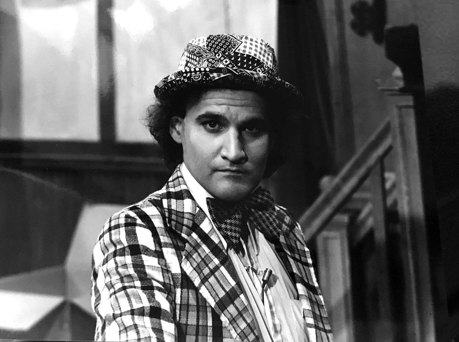 Uncle Floyd in his signature plaid jacket, patterned hat and oversized bow tie